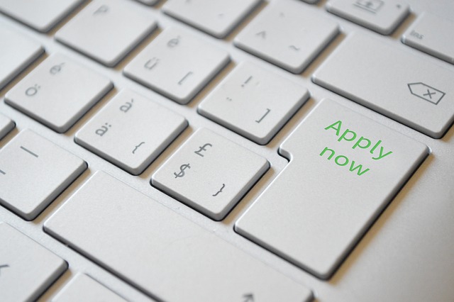 White keyboard with green "Apply Now" text on Enter button